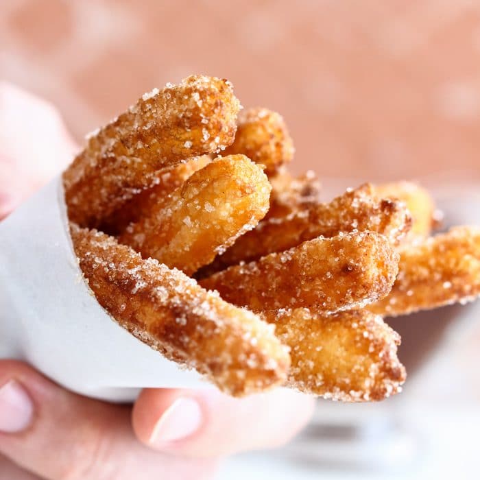 Traditional churros covered wit sugar