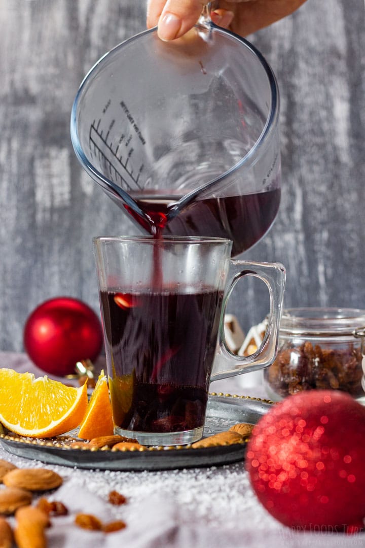 Pouring mulled wine to the glass