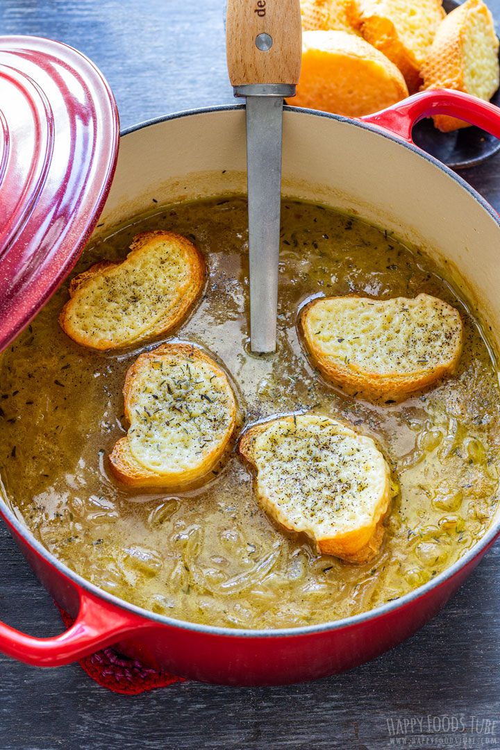 French onion soup and bread covered with cheese floating on top