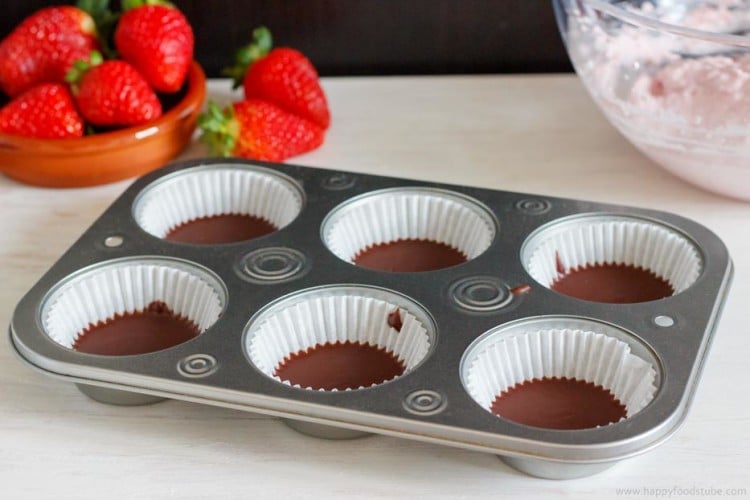 Chocolate cups ready to be filled with strawberry mousse.