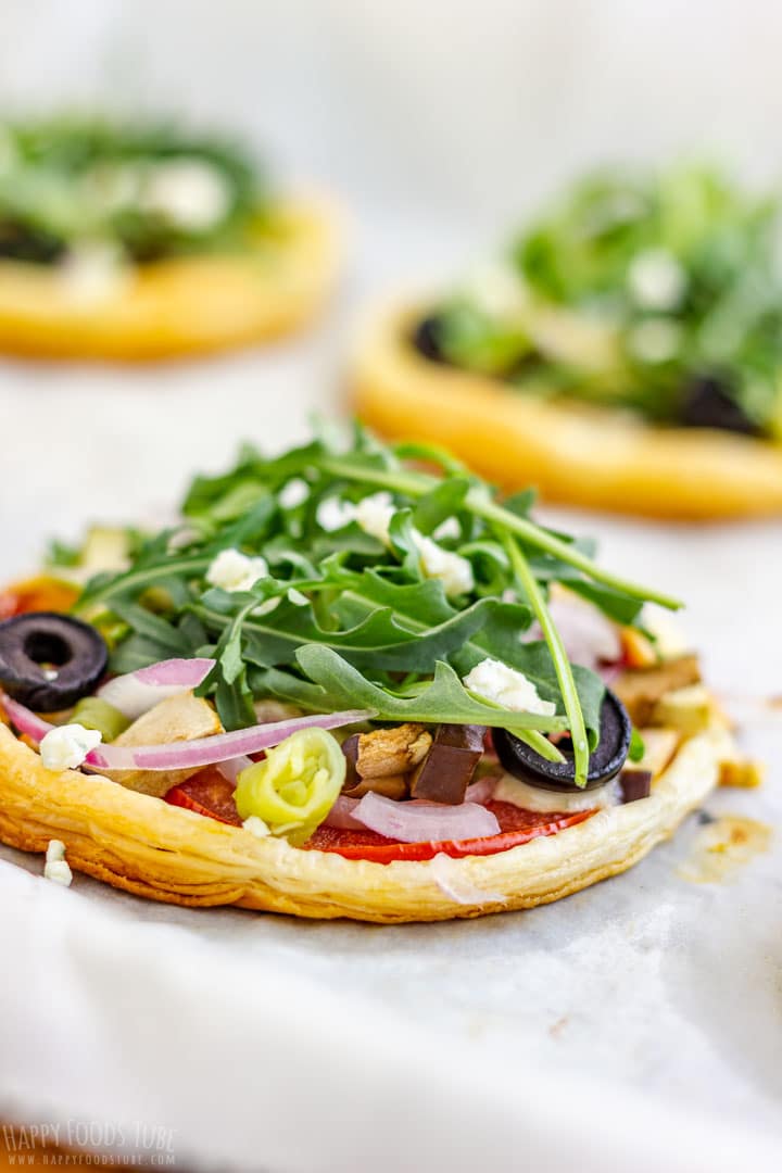 Mini Vegetarian Puff Pastry Pizzas Topped with Arugula