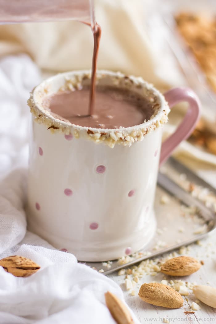 Pouring hot cocoa to the mug