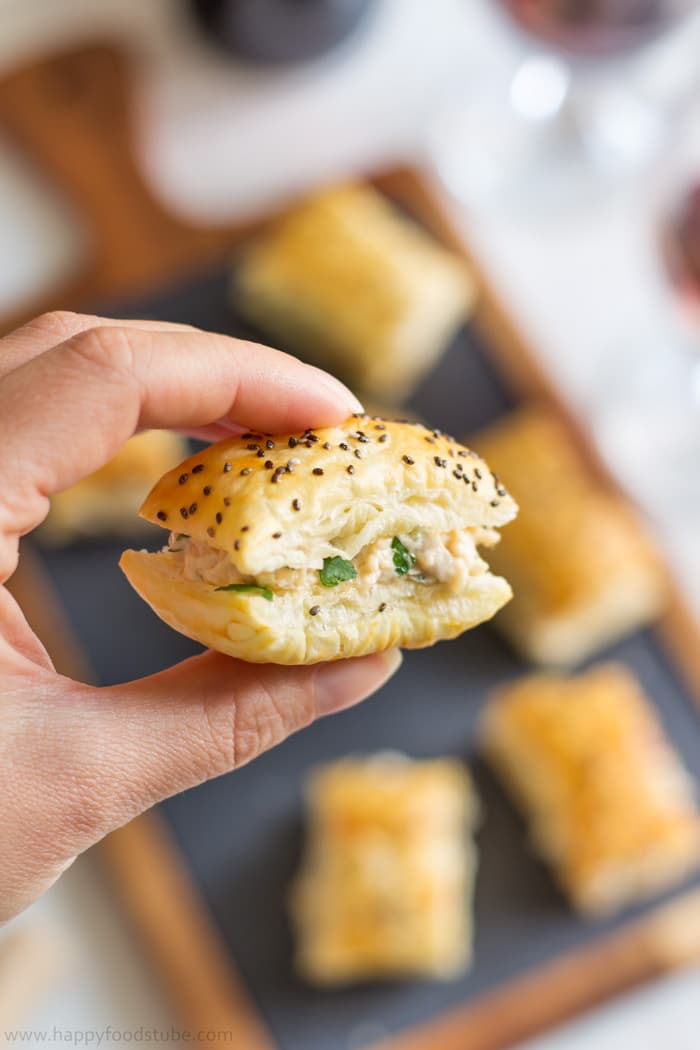 Close-up of mango chicken puff topped with chia seeds.