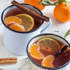 Indulge yourself in a cup of Mulled Mixed Fruit Cider with Mandarins! This warm drink made with mixed fruit cider and rum is perfect for cold days! | happyfoodstube.com