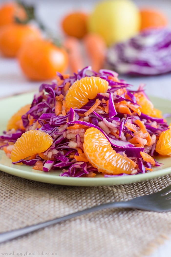 Raw red cabbage salad with mandarin slices.