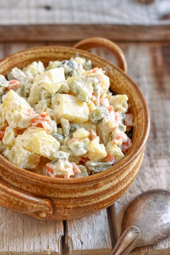 Lighter version of potato salad with dill pickles and carrots.