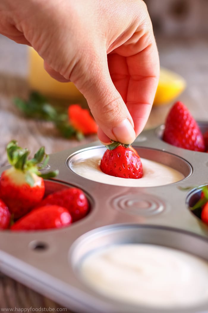 Dipping strawberry to lemon curd dip.