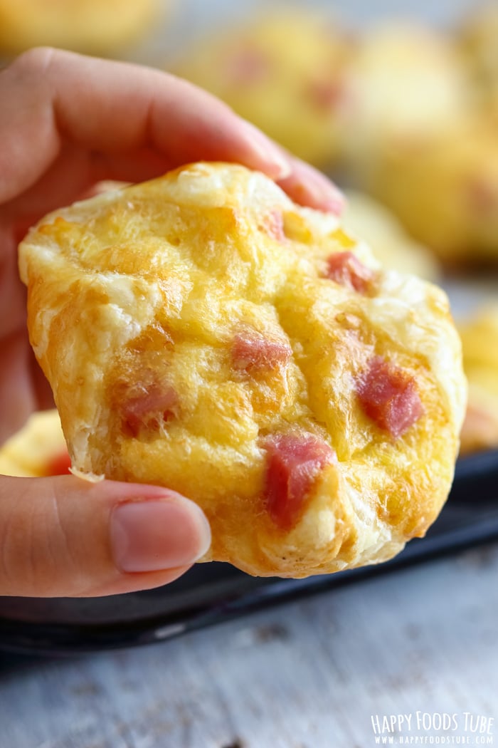 Holding freshly baked ham and cheese jambon.