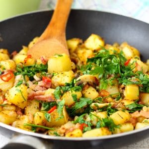 Pan fried breakfast potatoes with bacon, mushrooms, parsley and chili.