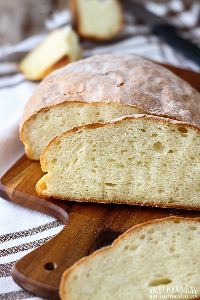 Freshly baked homemade potato bread on the wooden chopping board