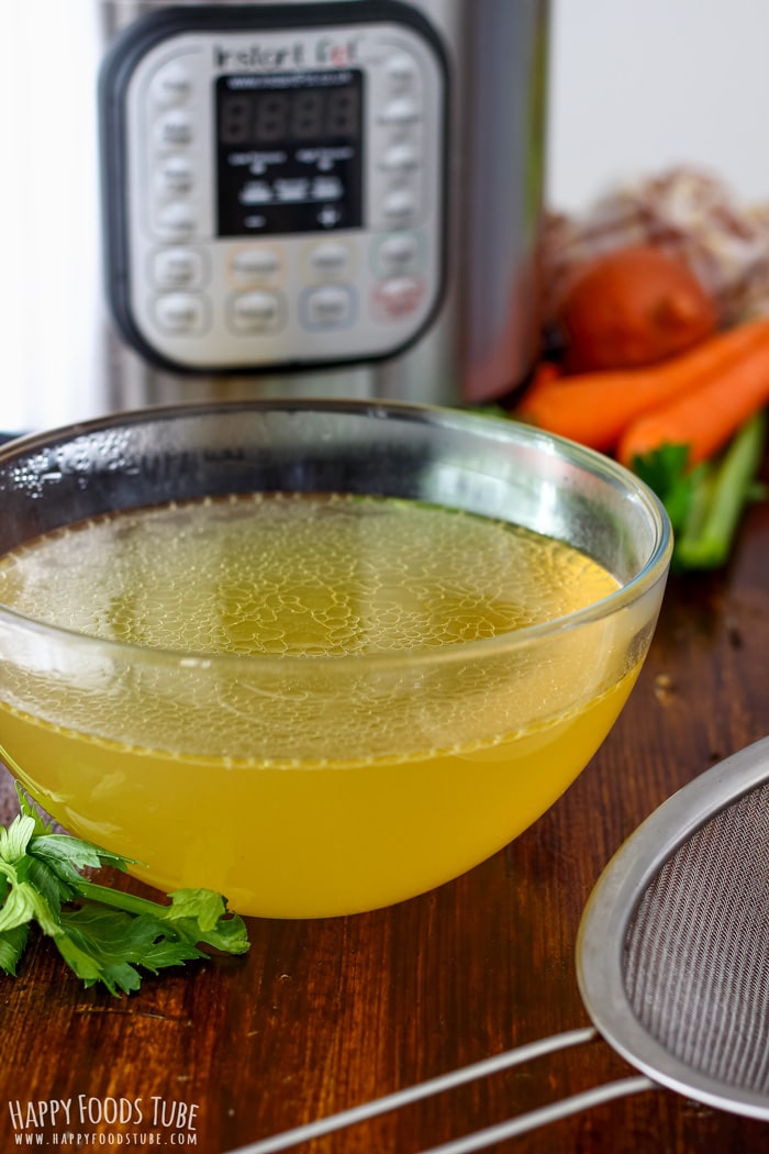 Homemade Instant Pot Chicken Stock in a glass bowl