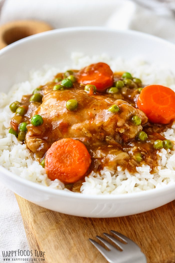 White bowl filled with Instant Pot Guinness Chicken Thighs and rice
