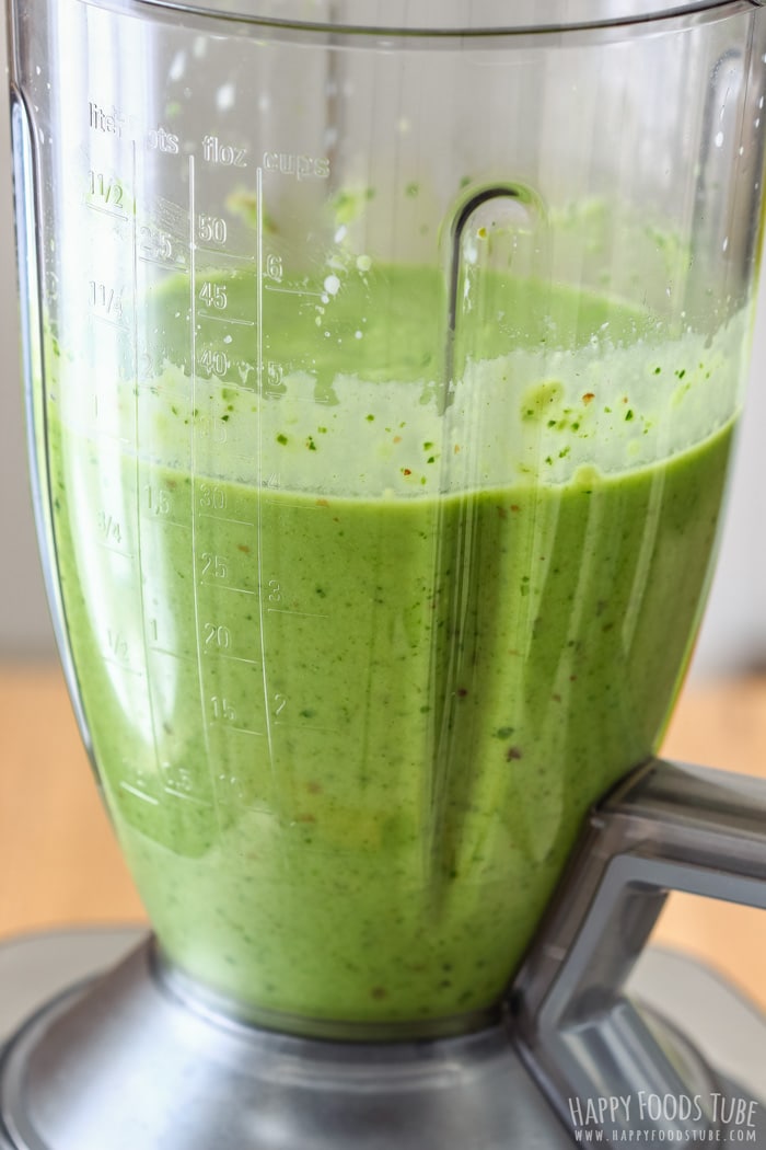 Freshly made green Spinach Cucumber Smoothie in the blender jug