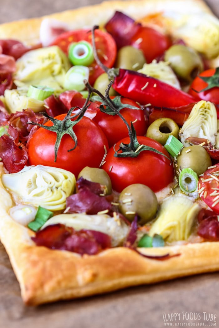 Freshly baked Artichoke Tart with tomatoes, peppers and artichokes