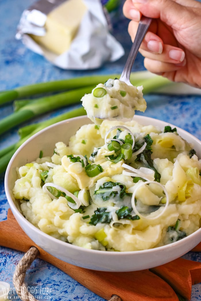 Spooning freshly made Creamy Irish Colcannon