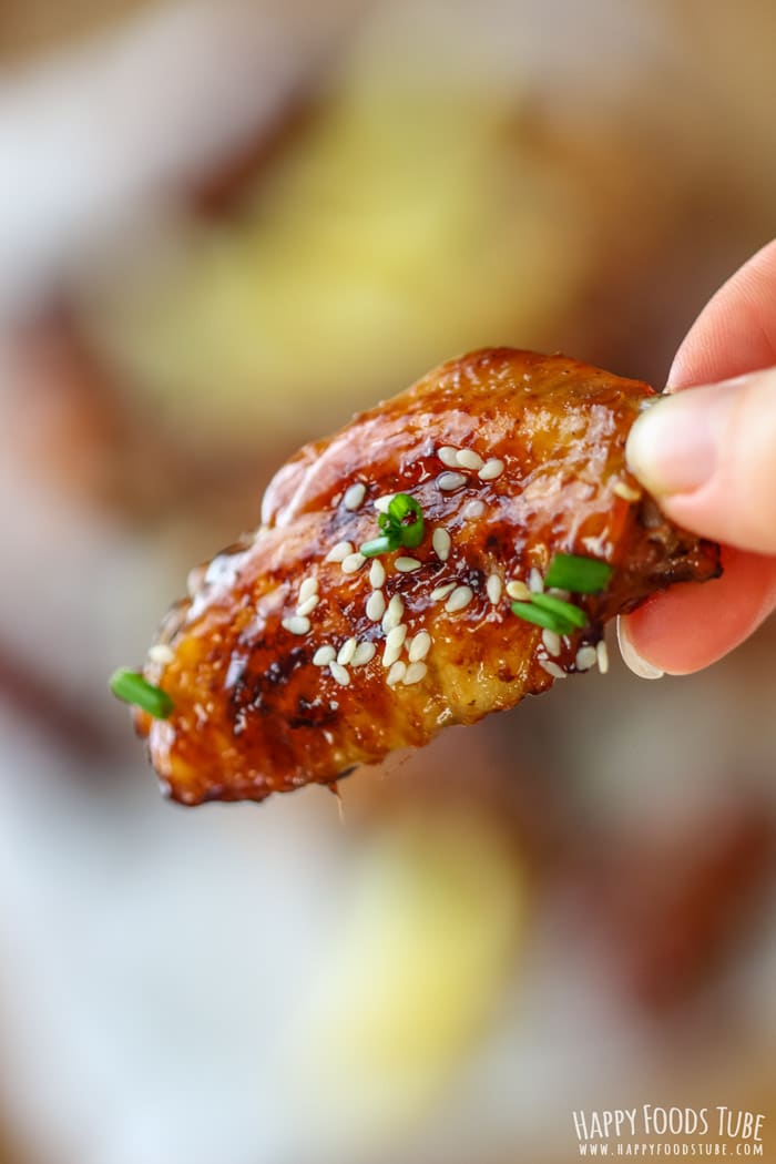 Sticky Hoisin Chicken Wings on the hand