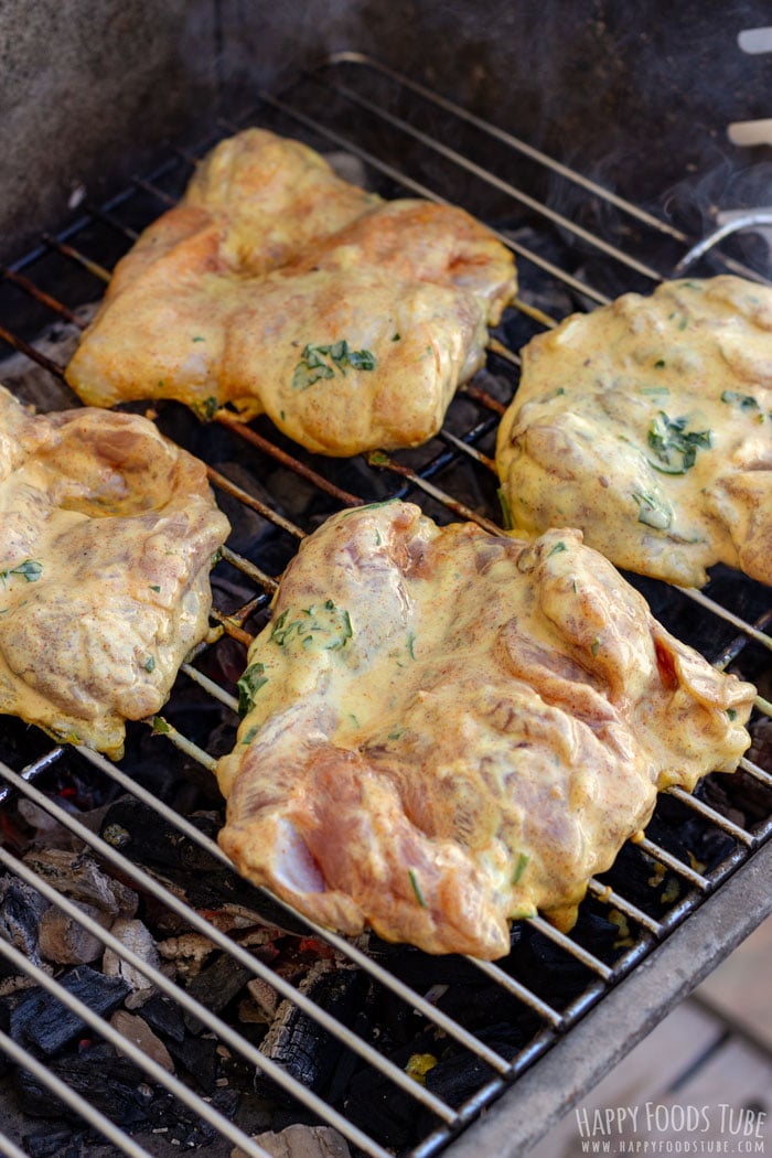 Grilling the yogurt marinated chicken thighs