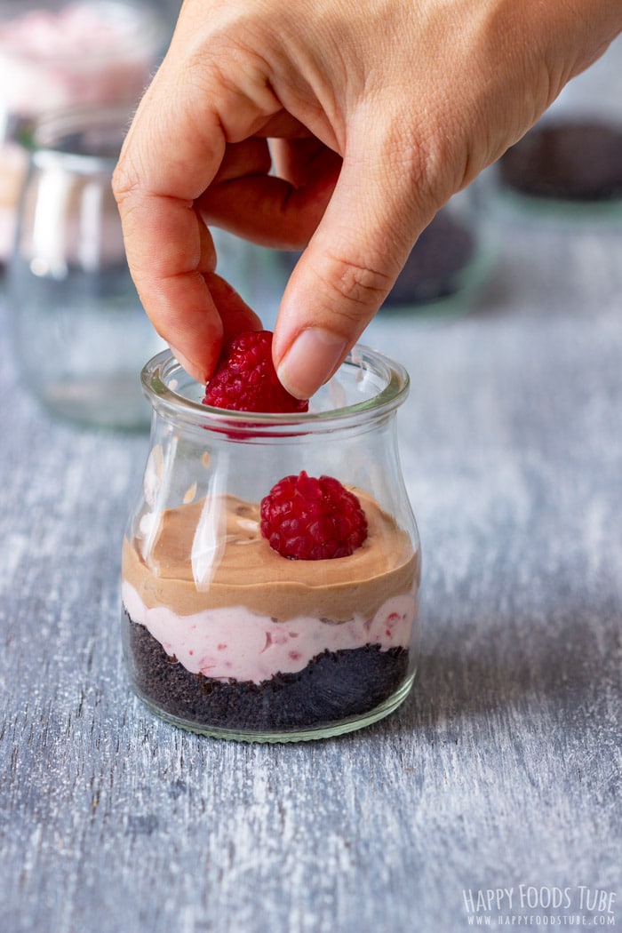 Adding the Fresh Raspberries to Raspberry Oreo No Bake Dessert