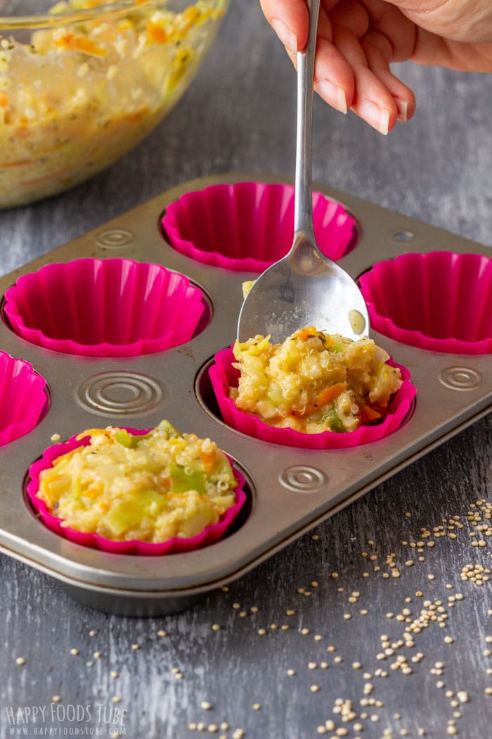 Filling the muffin cups with quinoa egg mixture