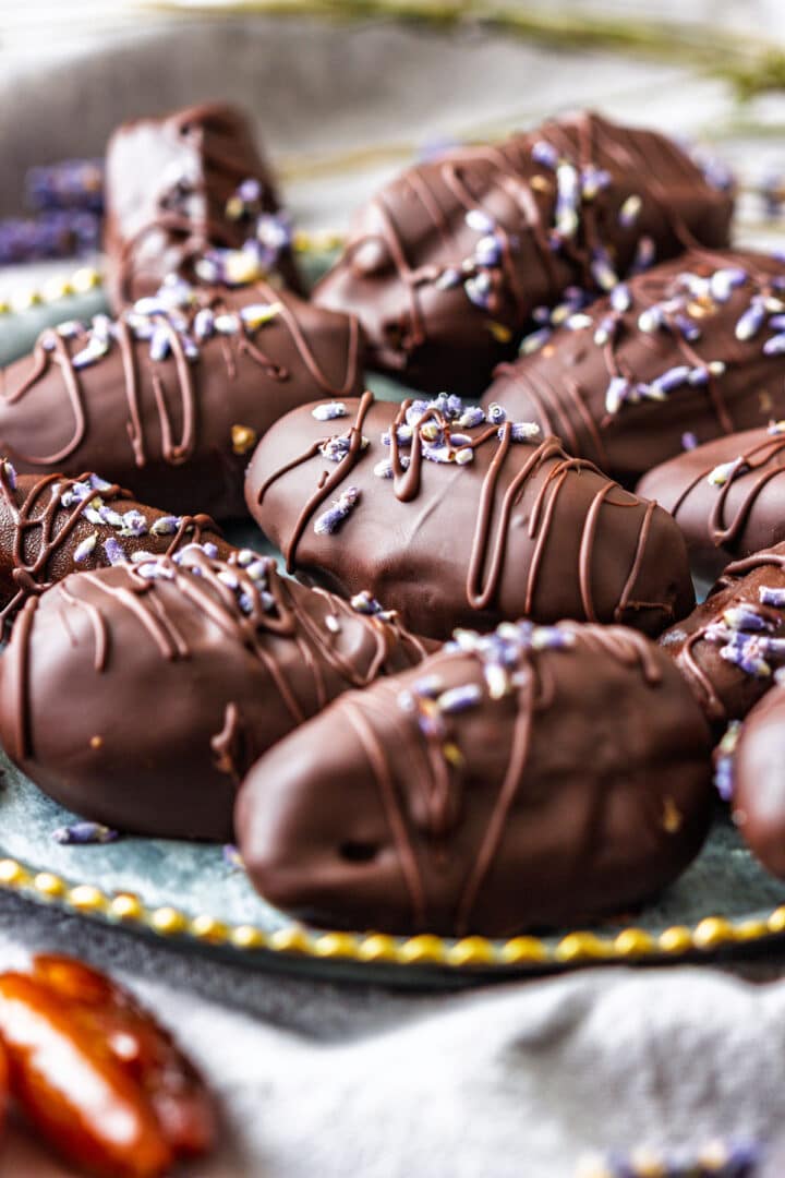 Gourmet chocolate-covered dates with peanut butter filling, drizzled with chocolate.