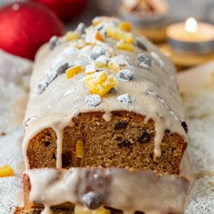 Festive gingerbread loaf with cinnamon icing, candied orange peel and chocolate chips.