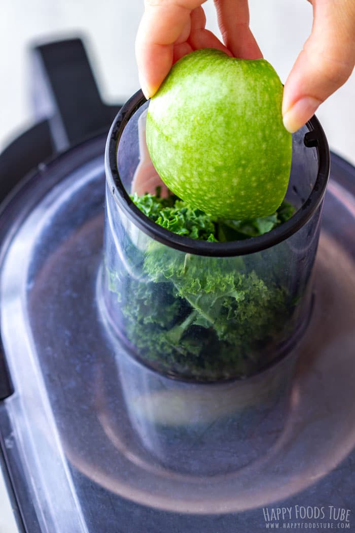 Juicing apples for homemade green juice.