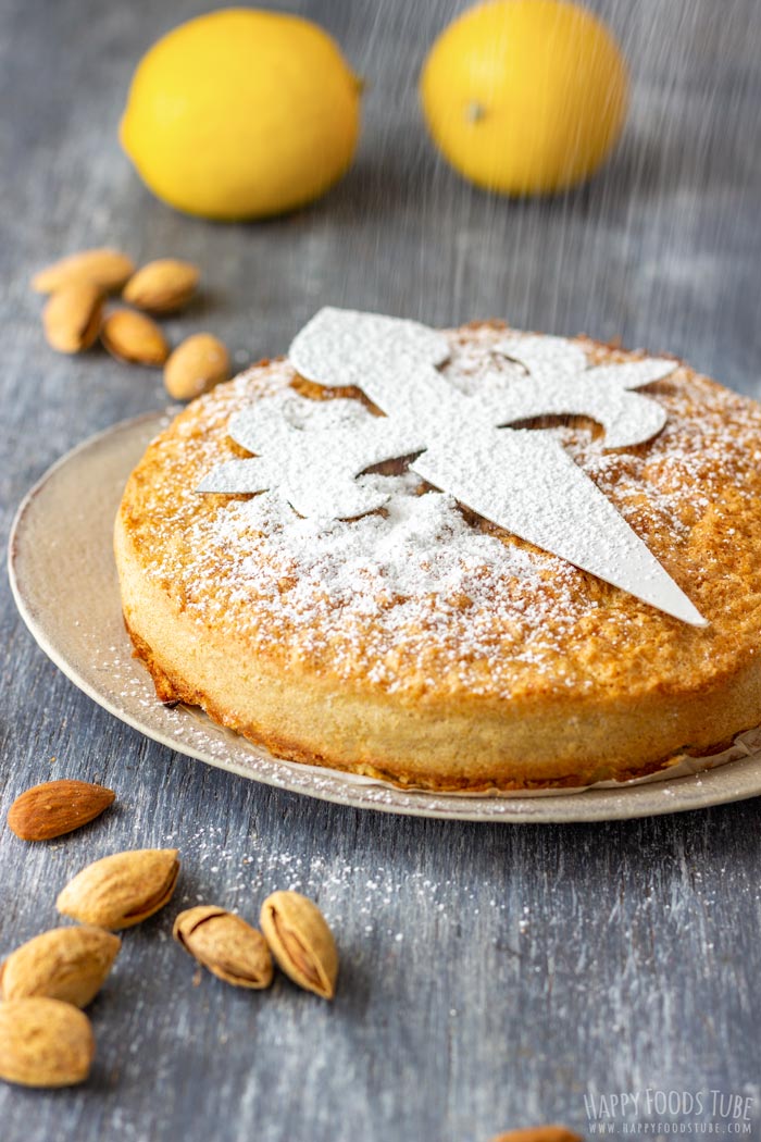 Dusting the Spanish Almond Cake with Powdered Sugar