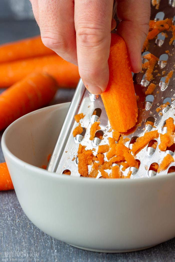 Grating Carrots for Homemade Meatball Soup