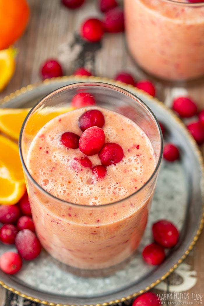 Healthy Orange Cranberry Smoothie Topped with Frozen Cranberries