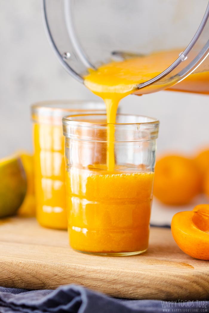 Pouring Freshly Made Apricot Mango Smoothie to the Glass