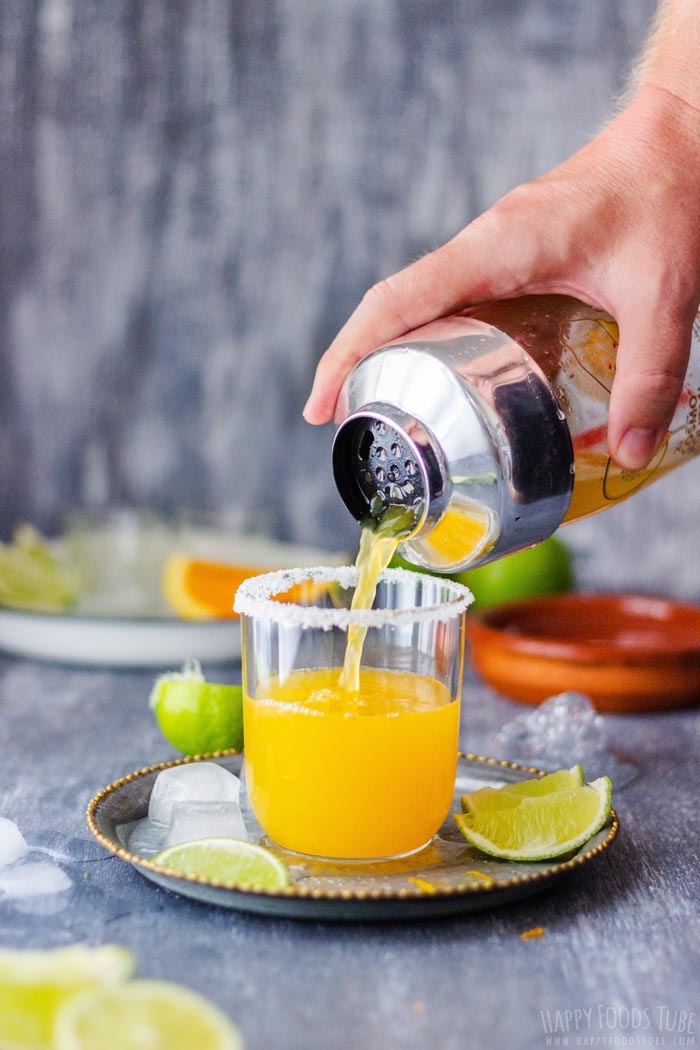 Pouring Orange Margarita to the Glass