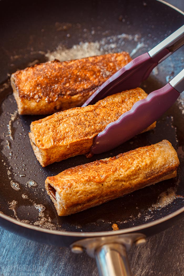 How to make Nutella Banana French Toast Roll Ups Step 5 - Frying the golden brown roll ups on the skillet