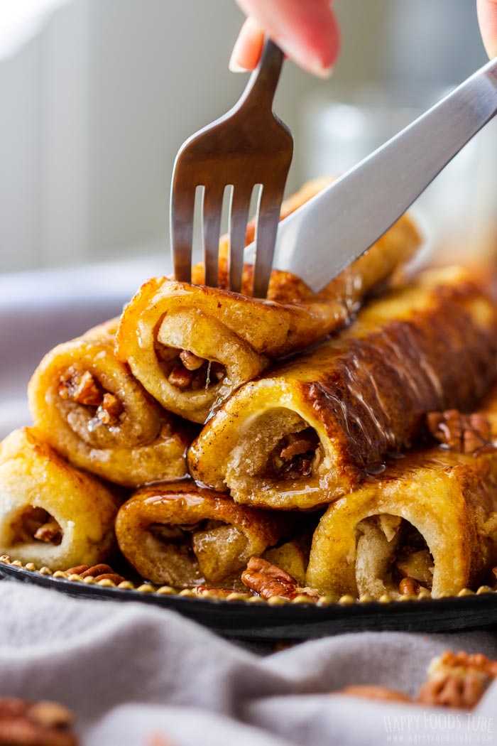 Slicing Freshly MadeMaple Pecan French Toast Roll Ups