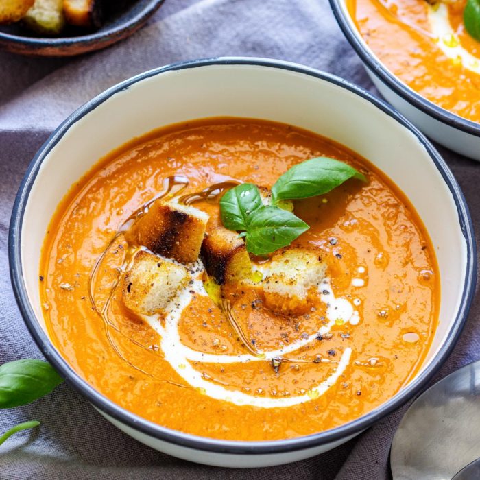 Creamy Tomato Soup with Fresh Basil Leaves