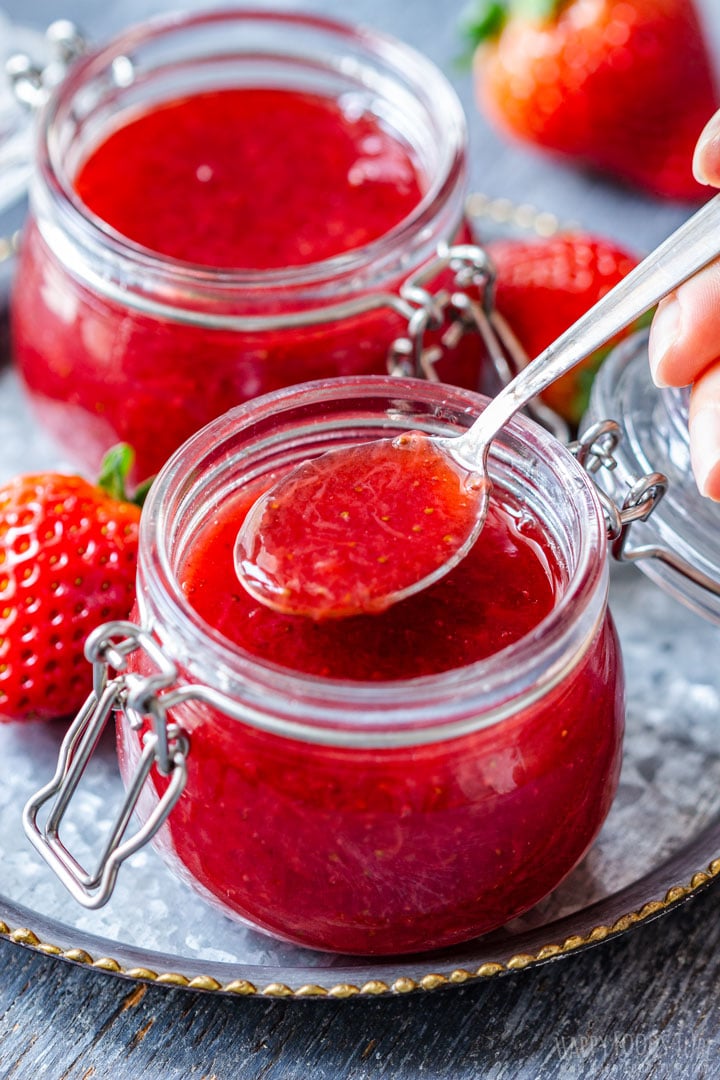 Spooning Instant Pot Strawberry Sauce