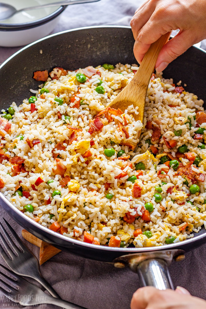 Serving Bacon Fried Rice with wooden spoon