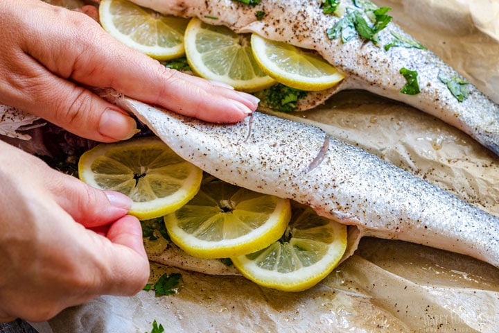 Showing how to fill sea bass