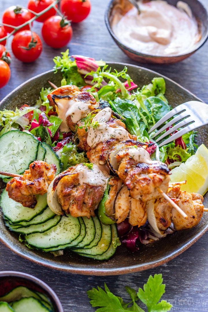 Grilled Chicken Kabobs with Fesh Salad on the Plate