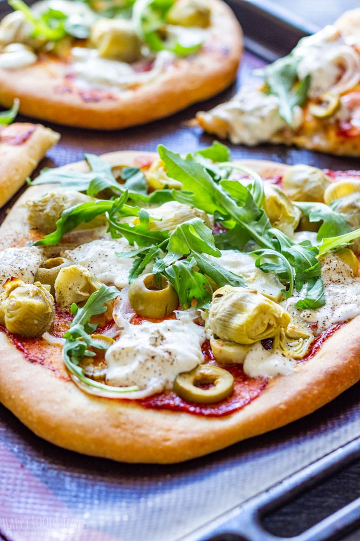 Burrata pizza with arugula and olives