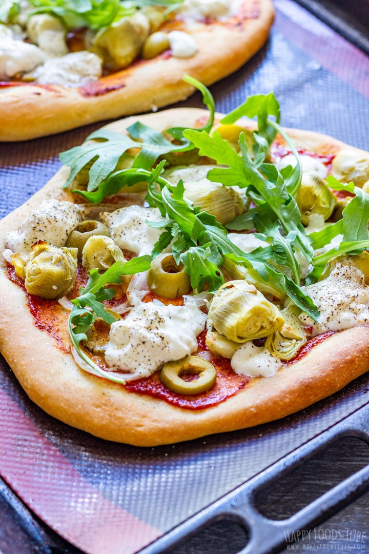 Homemade burrata pizza on a baking tray