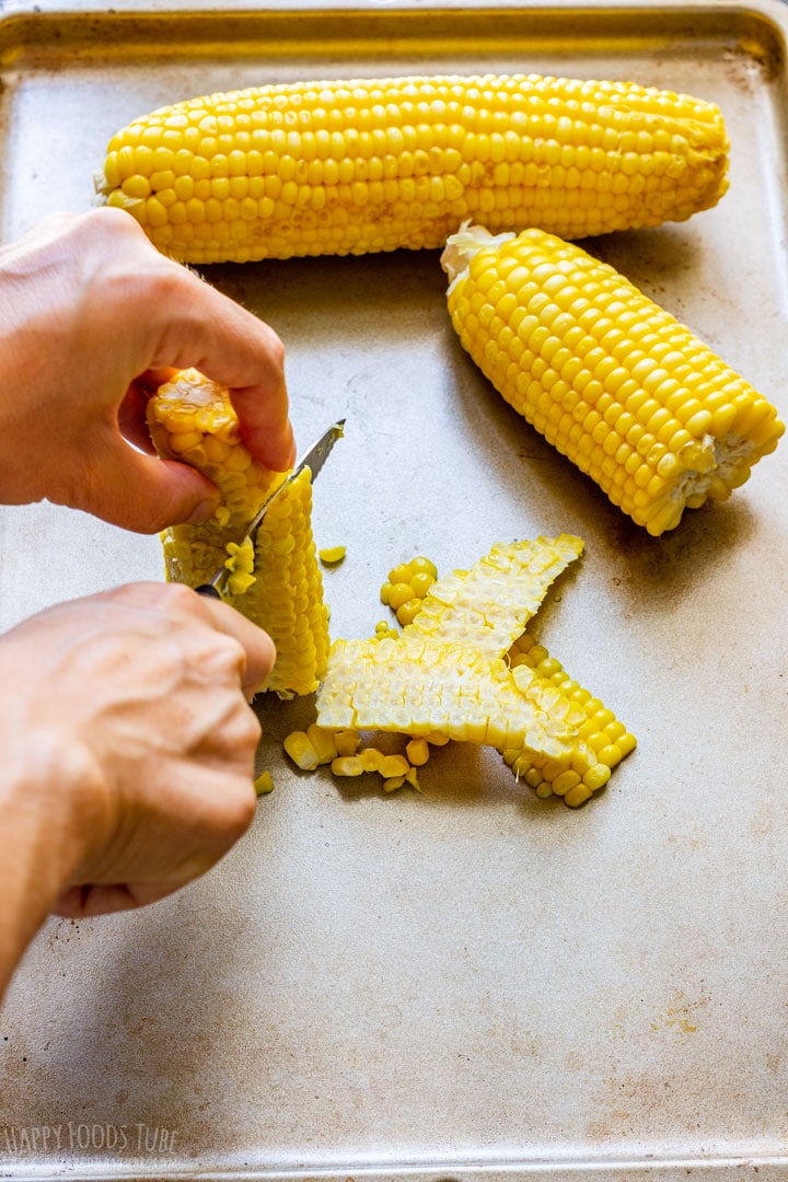 Removing corn kernels from the cob