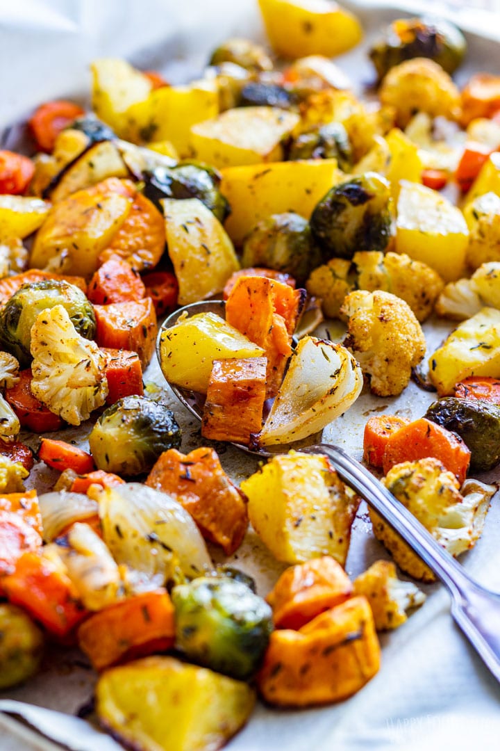 Colorful roasted fall vegetables on the baking tray