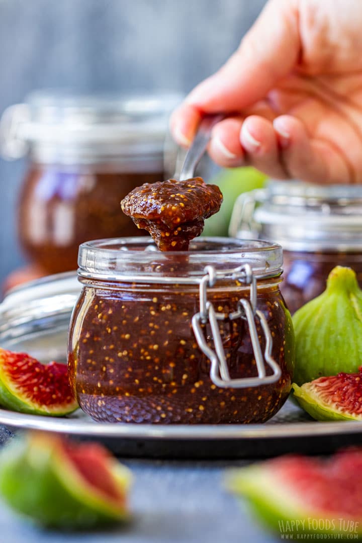 Spooning freshly made fig jam from jam