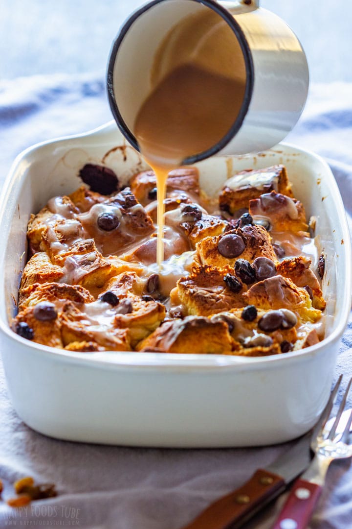 Pouring sauce over brioche bread pudding