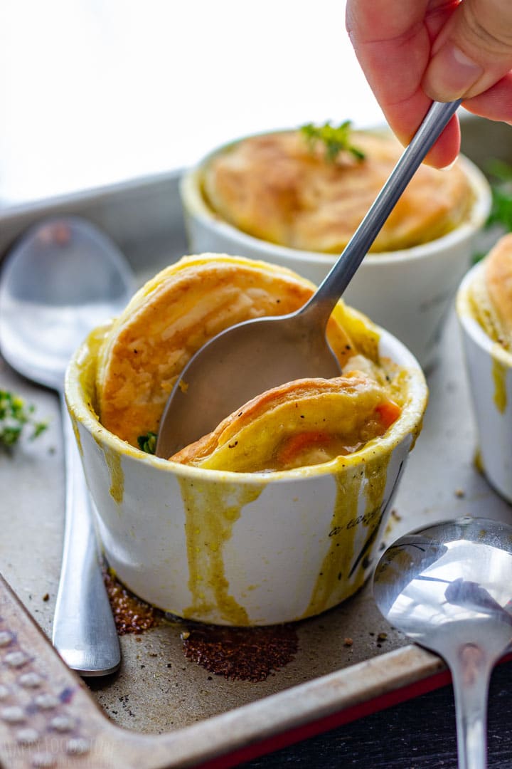 Spooning individual turkey pot pies