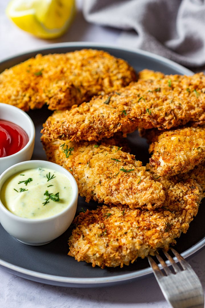 Crispy air fryer chicken tenders with sauce on the plate