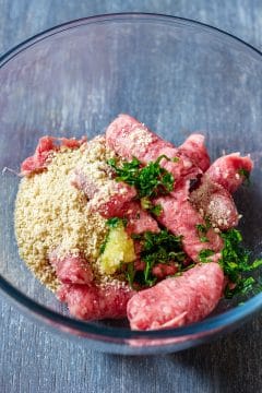 Add breadcrumbs, pressed garlic and finely chopped parsley.