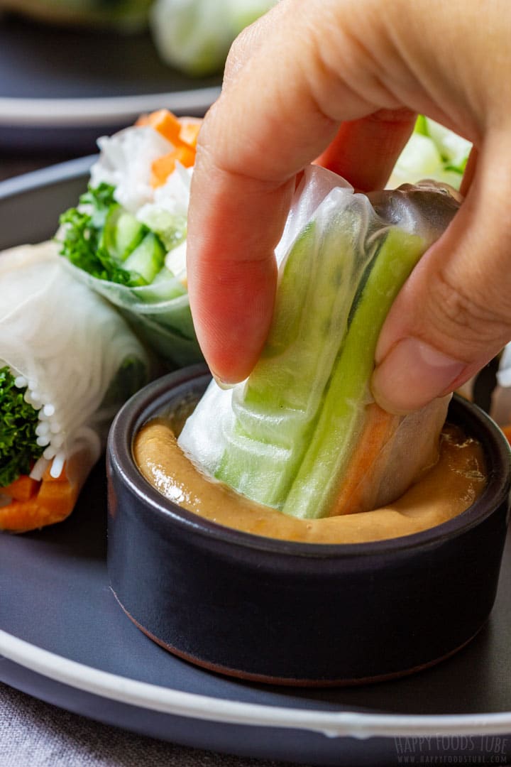 Dipping tofu spring roll to the homemade peanut sauce