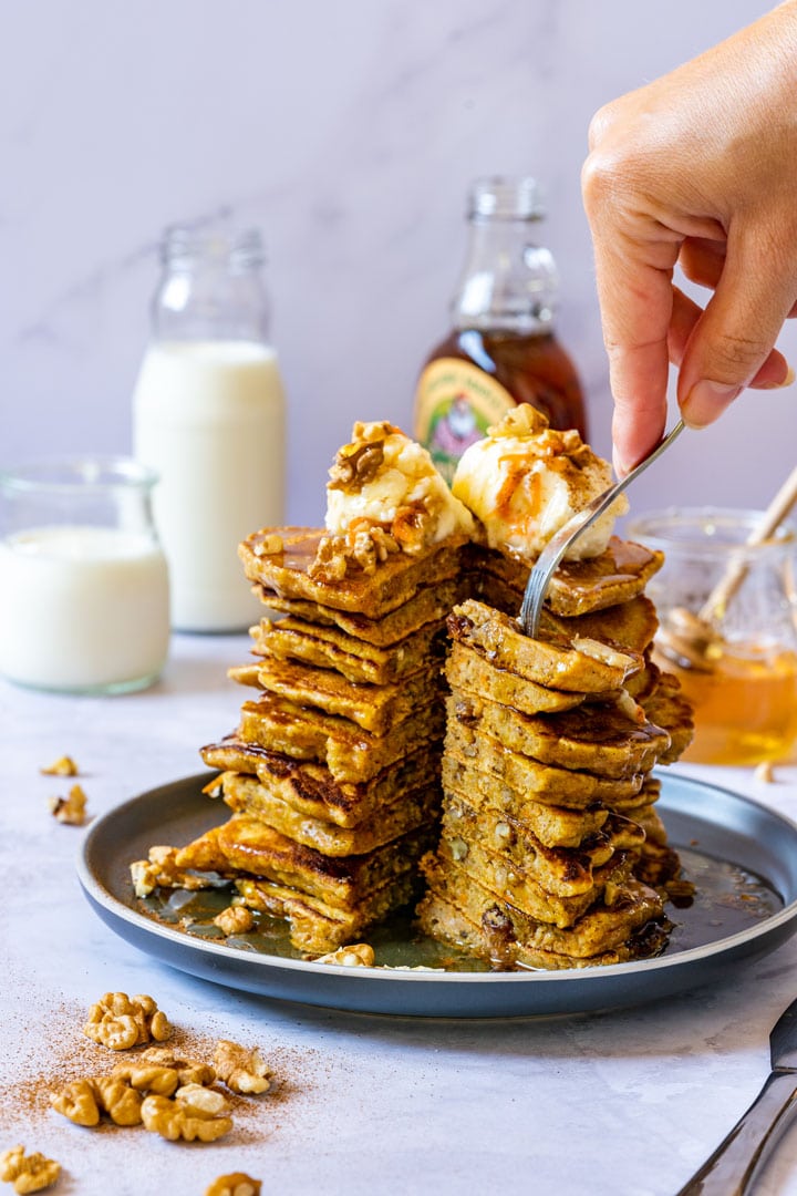 Carrot cake pancakes with raisins, walnuts and cream cheese pancake topping