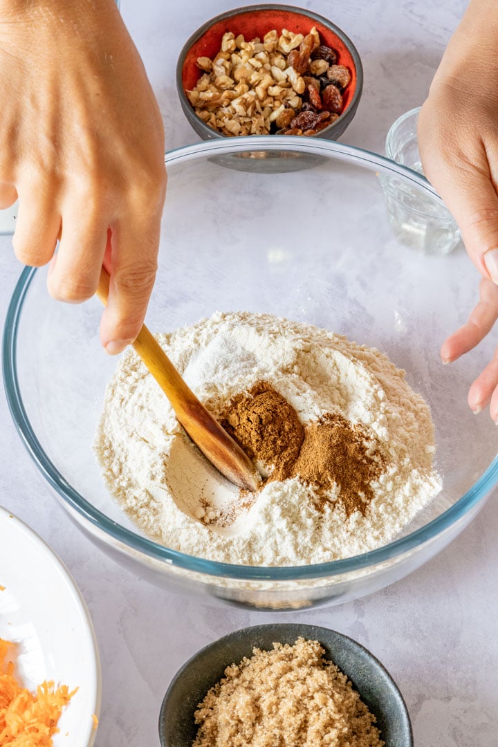 Combining flour, baking soda and cinnamon in a mixing bowl